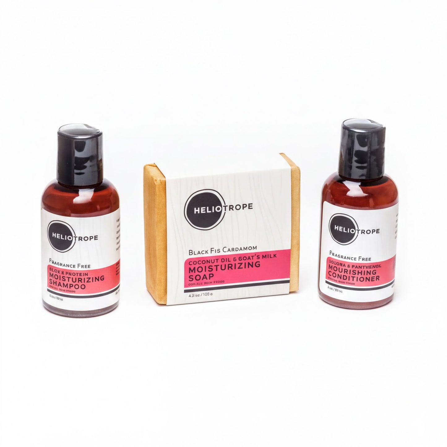three bottles of Heliotrope skincare products, including a black and white bar soap, a black and white shampoo, and a black and white conditioner.