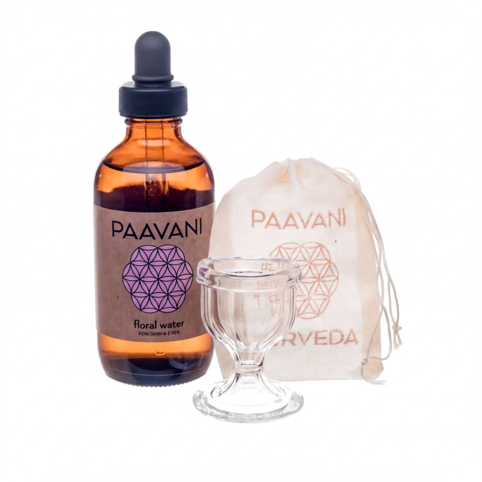 a brown glass bottle with a label that reads "PAAVANI", a clear glass cup, and a small white bag with a label that reads "PAAVANI".
