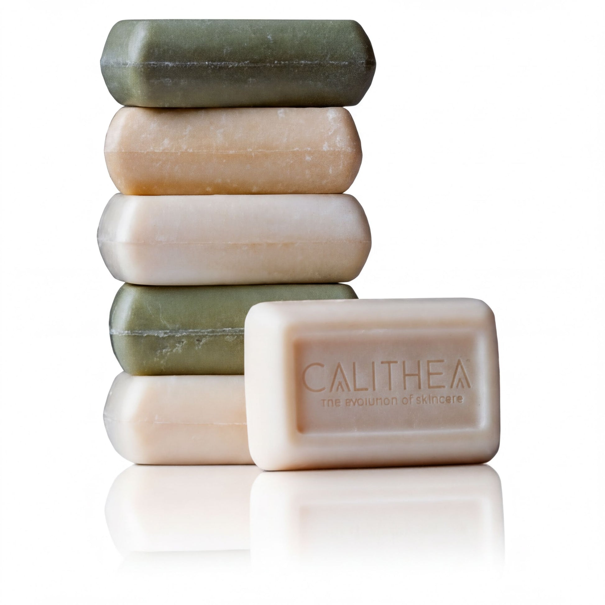A stack of five rectangular bars of soap, with one bar prominently displaying the word "CALITHEA" and the other bars being a mix of green and beige colors.