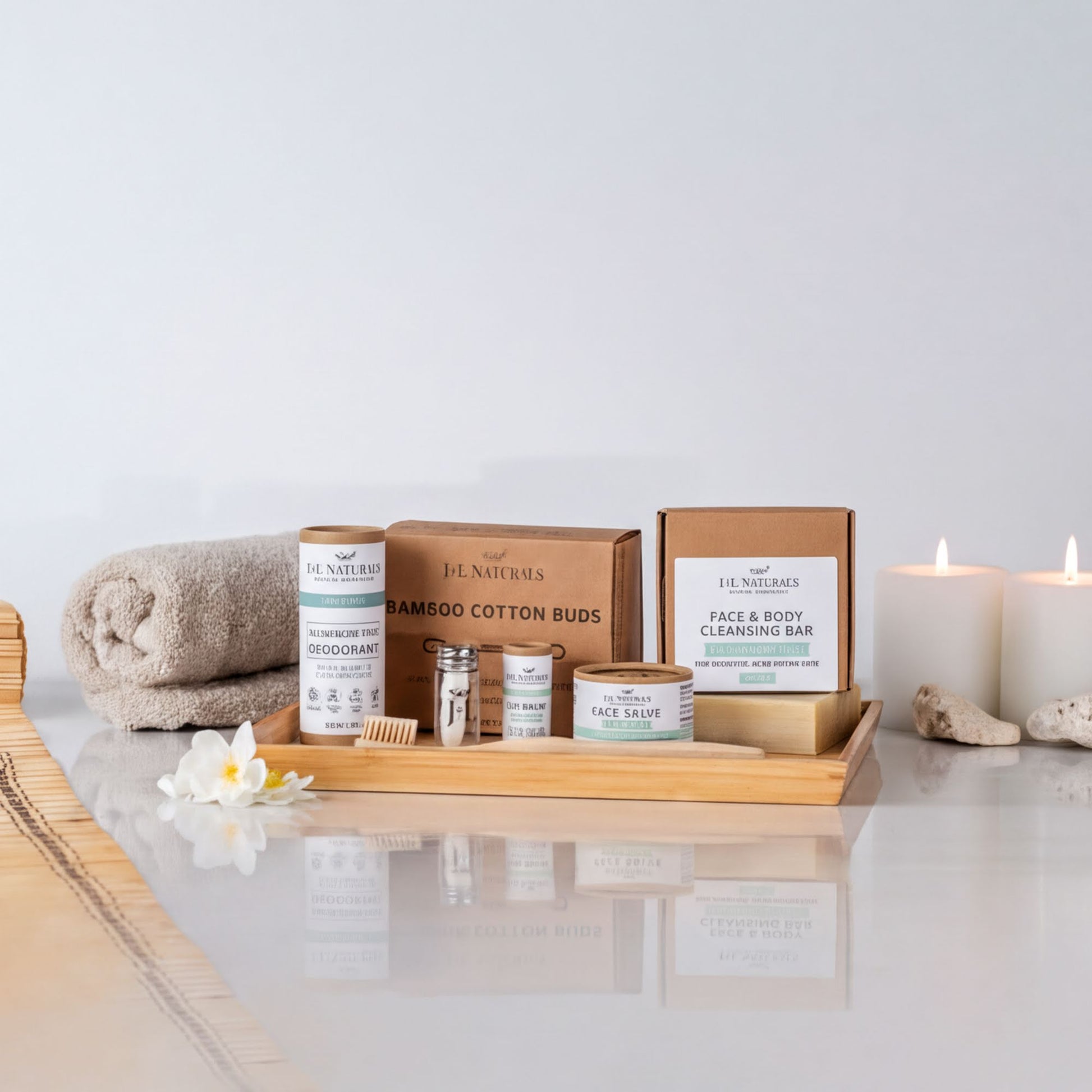 a collection of natural beauty products arranged on a wooden tray, with candles and a white flower adding to the aesthetic.