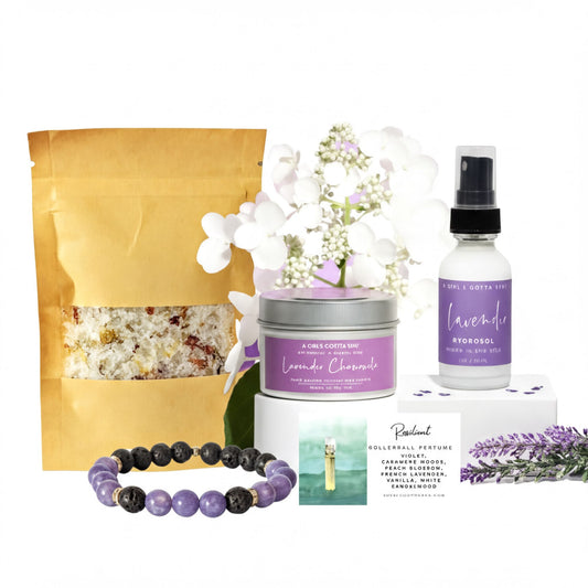 various items related to relaxation and self-care, including a bag of lavender-scented bath salt, a bottle of lavender-scented body mist, a small tin of lavender-scented candle, a rollerball perfume bottle, a bracelet with purple beads, and a bouquet of purple flowers.