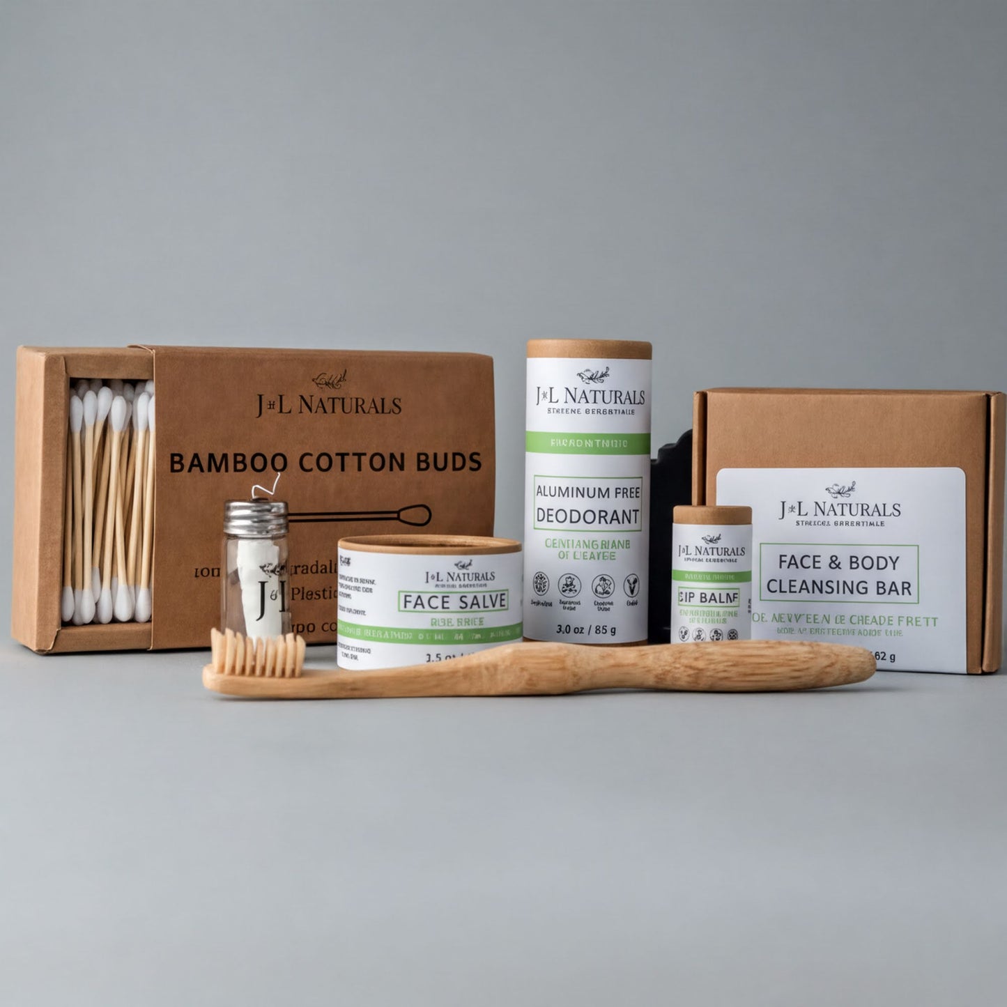 a collection of natural beauty products, including a bamboo toothbrush, a face balm, a deodorant, and a face and body cleansing bar, all packaged in cardboard boxes.