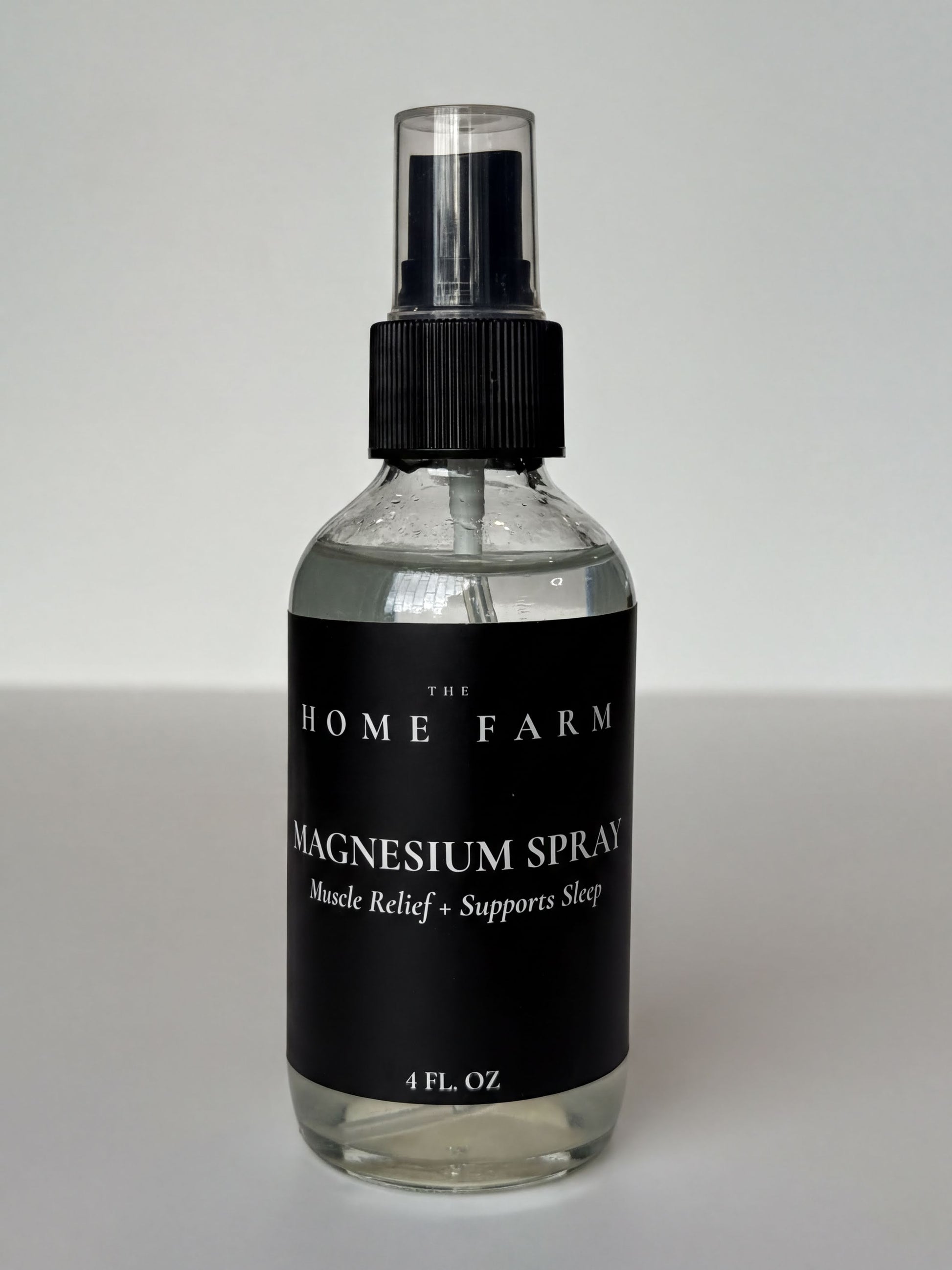 a bottle of magnesium spray with a black label.
