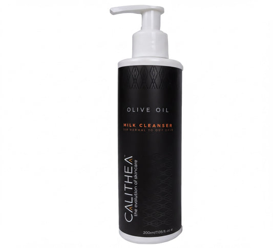 a bottle of CALITHEA Milk Cleanser, which is an olive oil-based skincare product.