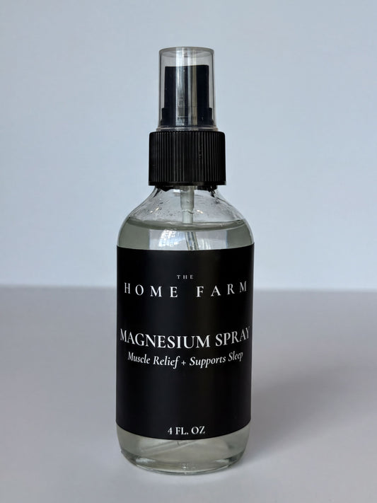 a bottle of magnesium spray with a black label.