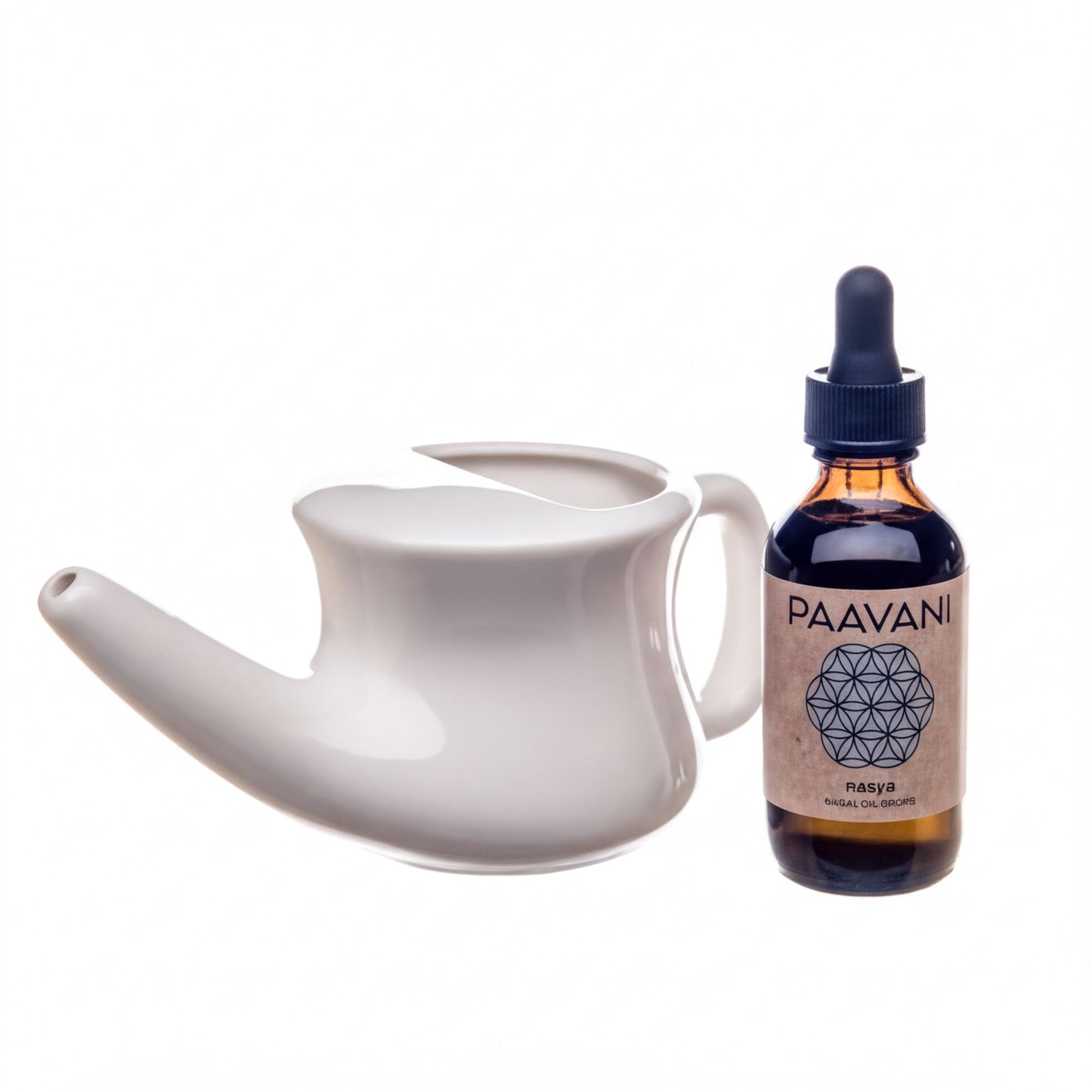 a white teapot and a brown bottle with a label that reads "PAAVANI NAOSYA" and "NAOSYA ROOT BALSAM".